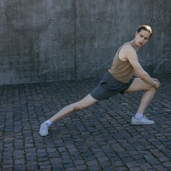 Smiling person stretching after a cardio workout, feeling energized and refreshed.